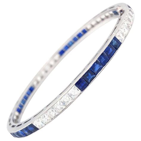 TIFFANY & CO.: A PLATINUM, SAPPHIRE AND DIAMOND BRACELET, CIRCA 1920